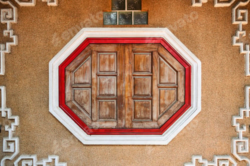 Preview: Wooden ancient oriental window on stone wall