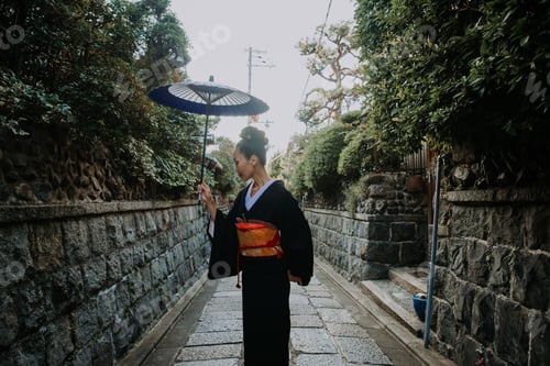 Preview: Beautiful japanese senior woman walking in the village. Typical japanese traditional lifestyle