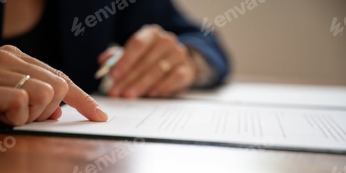Preview: Lawyer pointing to a signature line at the bottom of document