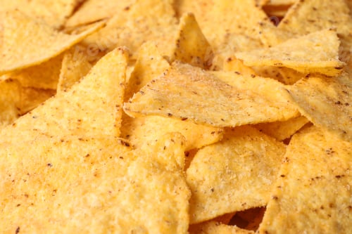 Preview: Tasty Mexican nachos chips as background, closeup