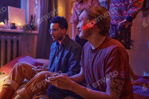 Preview: Young men playing video game