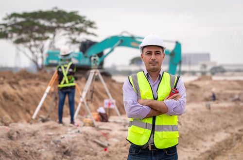Preview: Surveyor engineers wearing safety uniform ,helmet and radio communication with equipment theodolite