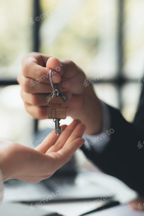 Preview: A home rental company employee is handing the house keys to a customer