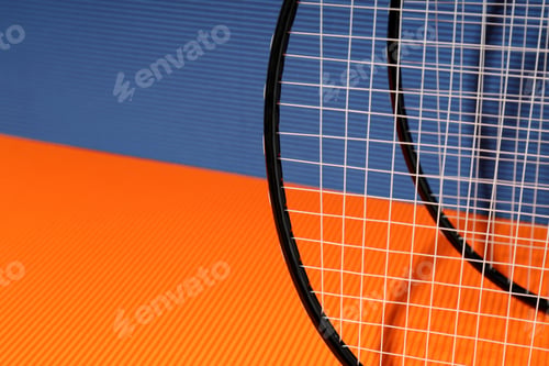 Preview: Badminton rackets on orange and blue textured backgrounds