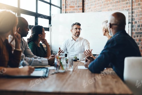 Preview: Shot of a businessman leading a meeting in the boardroom