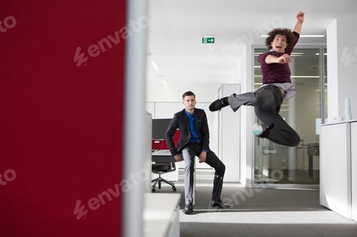 Preview: Office worker jumping in mid air