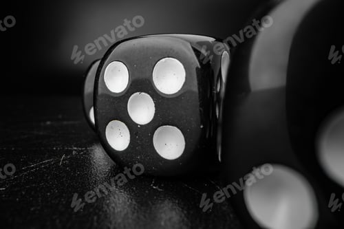 Preview: Group of playing dice cubes on black surface, macro