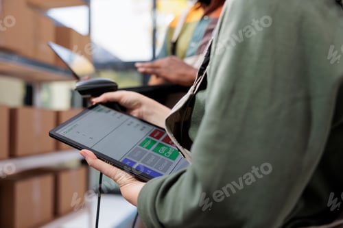 Preview: Diverse employees analyzing inventory report on tablet