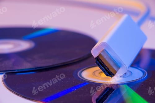Preview: Closeup of white HDMI cable with it's reflection on blank disc