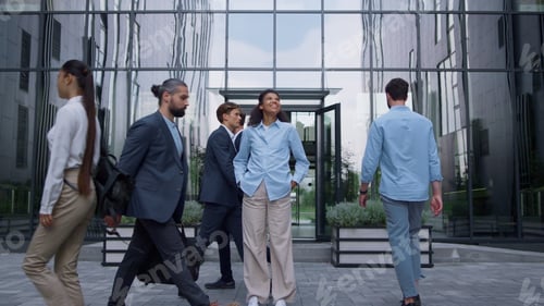 Preview: Smiling business lady standing feeling confident outdoors modern glass building.