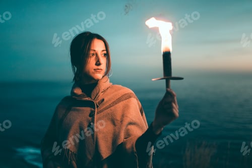 Preview: Girl holds a torch in her hand