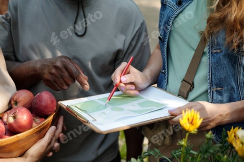 Preview: Young Adult Multiethnic Group Planning Outdoor Activity Using Map Together