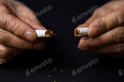 Preview: Closeup shot of a cigarette cut in half-quitting smoking concept