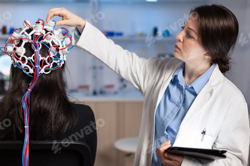 Preview: Back view of woman patient wearing performant eeg headset