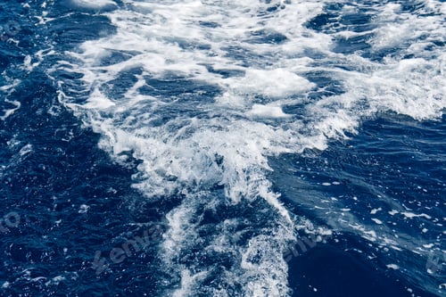 Preview: Abstract blue sea water with white waves. Blue sea texture with waves and foam. Mediterranean sea