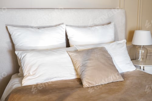 Preview: Cozy Bedroom Setting With Plush Pillows And Soft Bedding During Daylight Hours