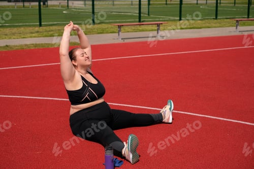 Preview: A young plump woman does stretching