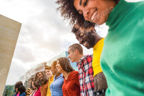 Preview: Young diverse people having fun outdoor laughing together - Focus on bald girl face