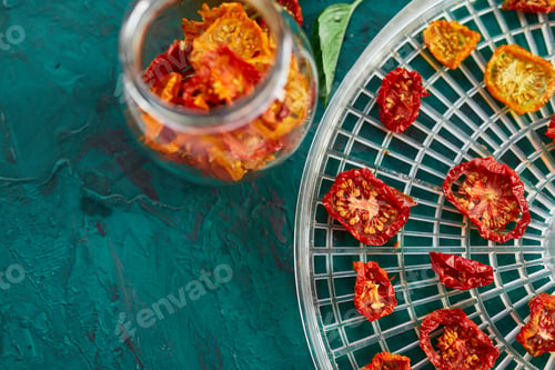Preview: Homemade sun dried tomatoes with herbs, garlic in olive oil in a glass jar