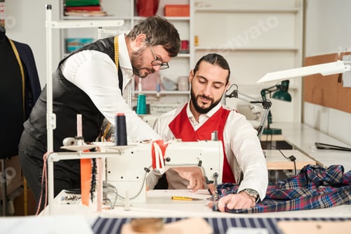 Preview: Men Working at a Sewing Machine in Tailor Shop
