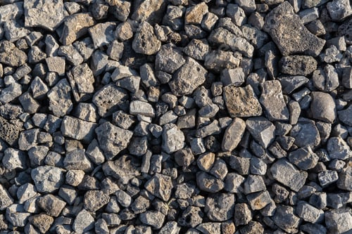 Preview: gray texture from pieces of lstones in a pile on the street. Dark gray Pattern of pebbles.