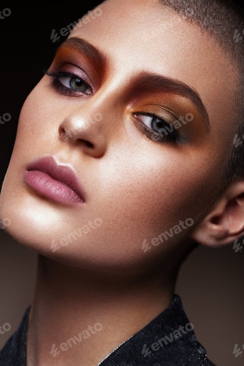 Preview: Beautiful woman portrait close up on black background with colorful make up.
