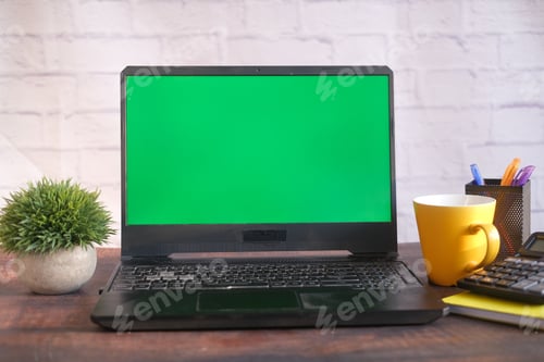 Preview: laptop with blank screen on office desk.