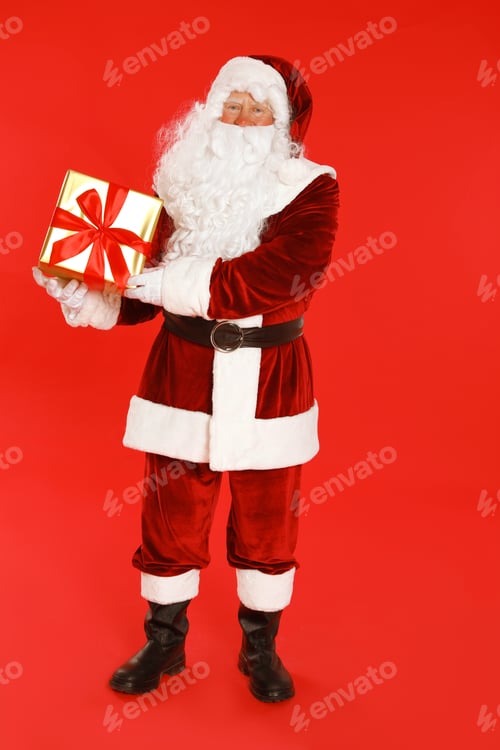 Preview: Authentic Santa Claus with gift box on red background