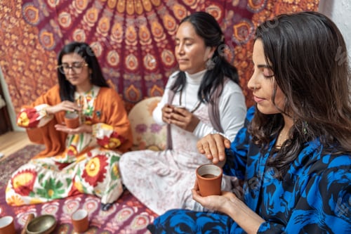 Preview: Women enjoying organic cocoa ceremony for alternative medicine and healthy living