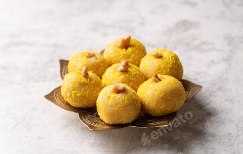 Preview: Delicious Yellow Sweets on a Decorative Plate