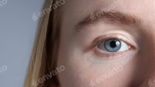Preview: Woman with beautiful eyes on light grey background, closeup