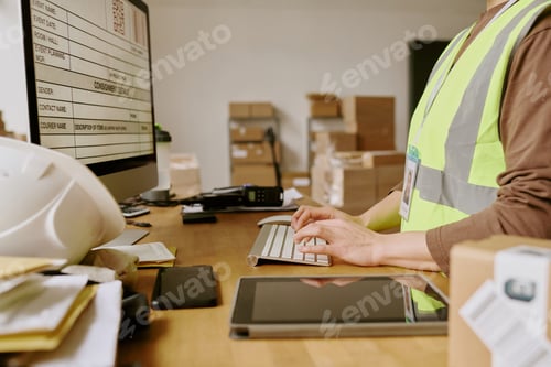 Preview: Worker Scanning Packages in Warehouse Environment