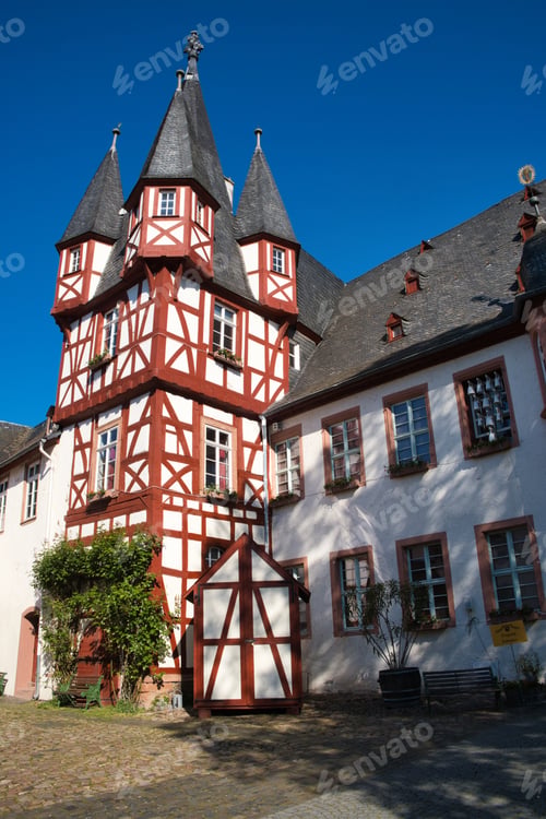 Preview: White and red skyscraper with trees in foreground, Rudesheim, Germany