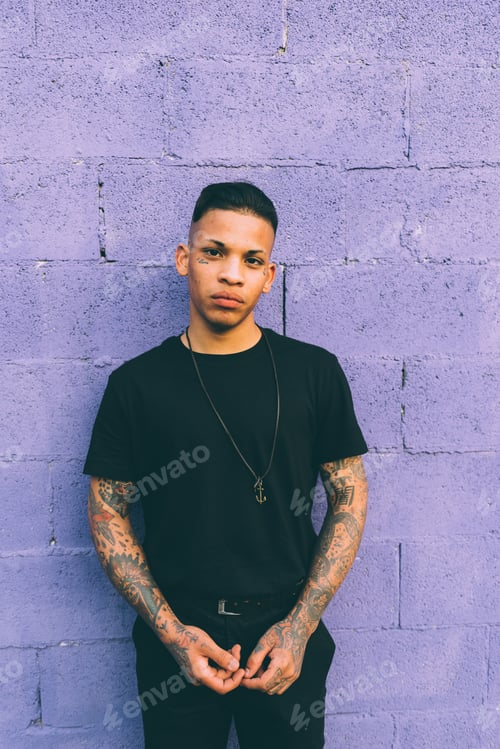 Preview: young man posing outdoor looking camera