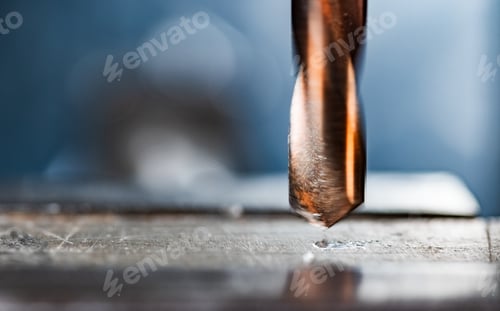 Preview: Drill close-up at the workplace in workshop