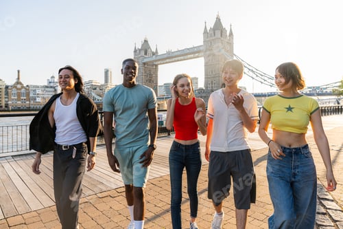 Preview: Multiracial group of happy young friends bonding in London