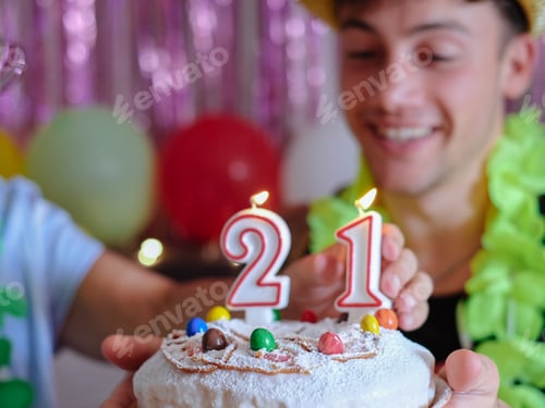 Preview: Joyful family birthday party at home, with elderly woman and young grandson turning 21