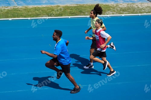 Preview: Athletes running on blue track during competition
