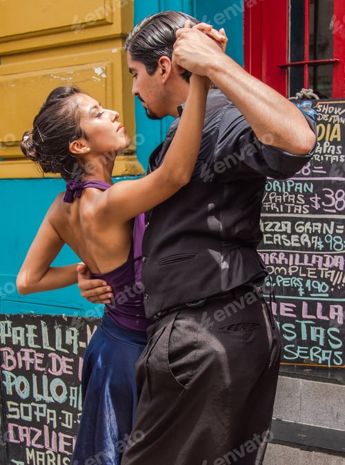 Preview: Buenos Aires, Argentina February, 01 2014: Couple dancing on street to guitar music