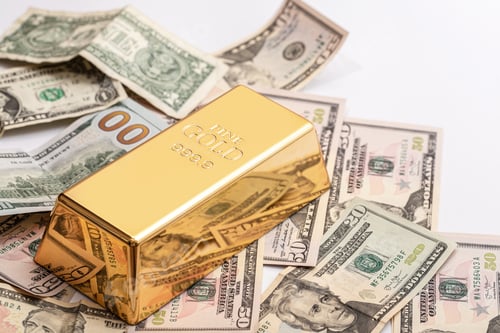 Preview: Expensive gold bar and US dollar bills