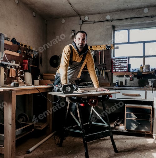 Preview: Man in his woodworking workshop, looking at camera, job, profession, carpenter.
