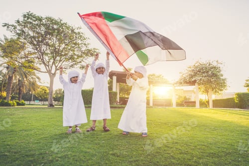Preview: children playing together in Dubai in the park.