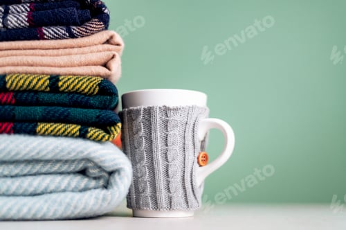 Preview: Stack of woolen checked blankets