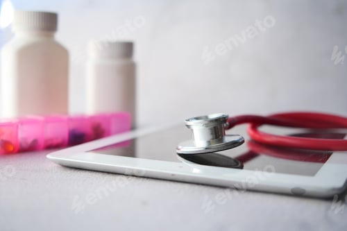 Preview: Medical Stethoscope On Modern Digital Tablet On White Background