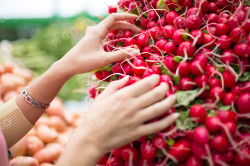 Preview: Woman buying vegetables on the market