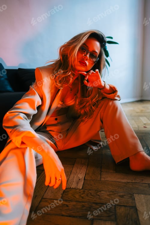 Preview: Woman in Suit Poses in Interior Setting