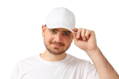 Preview: Man in white cap and shirt, smiling, on white