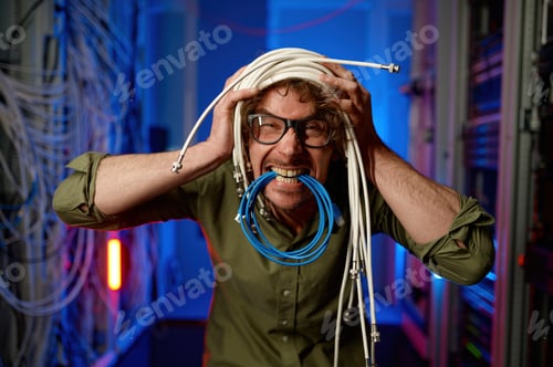 Preview: Funny crazy system administrator with head wrapped in wires fooling around