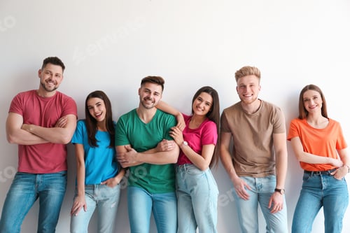Preview: Smiling Friends Standing Together Against a White Wall