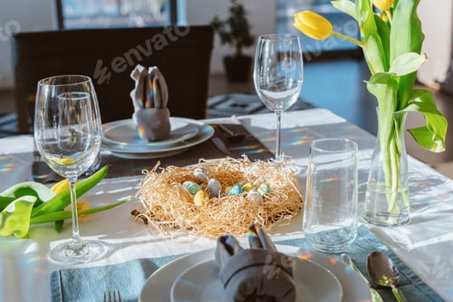 Preview: Beautiful Easter table setting with festive decor indoors. Napkin in shape of rabbit ears